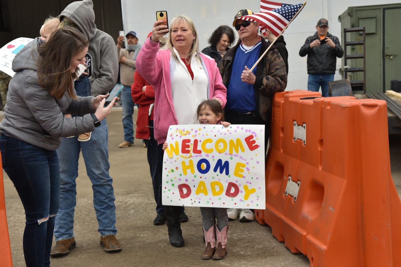 Tennessee Soldiers come home from deployment to Poland Family members of Soldiers waiting for loved ones to exit plane