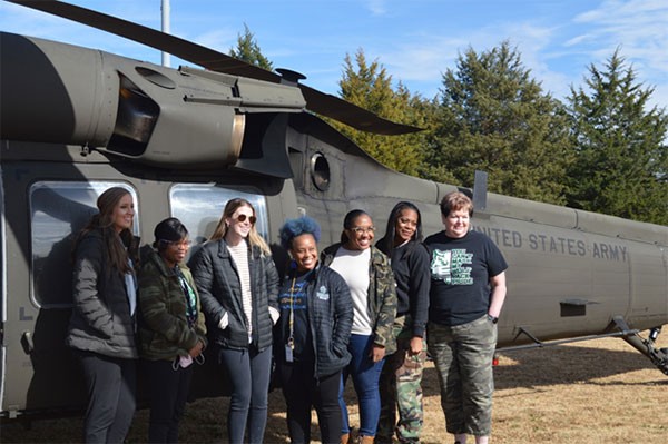 Teachers from Cordova High School pose alongside a UH-60 Blackhawk helicopter in Cordova on Nov. 18. Several of the school’s teachers and staff flew aboard two Blackhawks as part of an educators’ flight organized by recruiters from the Tennessee National Guard. (Photo by Sgt. Finis L. Dailey, III) Teachers from Cordova High School pose alongside a UH-60 Blackhawk helicopter in Cordova on Nov. 18. Several of the school’s teachers and staff flew aboard two Blackhawks as part of an educators’ flight organized by recruiters from the Tennessee National Guard. (Photo by Sgt. Finis L. Dailey, III)