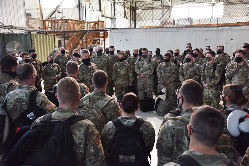 Maj. Gen. Jeff Holmes, Tennessee’s Adjutant General, welcomes home Soldiers from the 253rd Military Police Company just after they arrived at Smyrna’s Volunteer Training Center on Feb. 3, following an 11-month deployment in support of overseas contingency operations. (Photo by Capt. Kealy Moriarty) Maj. Gen. Jeff Holmes speaking to large group of Soldiers in a hanger after their return from deployment