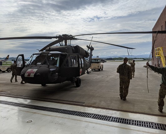 A Tennessee Army National Guard medical flight crew prepares for an emergency air evacuation mission after a hiker suffered a stroke while on the Appalachian Trail in the Great Smoky Mountain National Park, April 15. (Courtesy Photo from the Tennessee National Guard) Tennessee Army National Guard Helicopter preparing to take flight