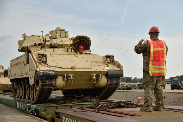 Soldiers assigned to the 278th Armored Cavalry Regiment load a Bradley Fighting Vehicle onto a train in preparation for movement to Fort Hood, Texas, June 21. Approximately 1,000 vehicles, tanks and pieces of equipment are being loaded onto trains in preparation for XCTC, a three-week training exercise that will be taking place in Fort Hood over the summer. (Photo by Sgt. 1st Class Timothy Cordeiro) Soldiers assigned to the 278th Armored Cavalry Regiment load a Bradley Fighting Vehicle onto a train in preparation for movement to Fort Hood, Texas, June 21. Approximately 1,000 vehicles, tanks and pieces of equipment are being loaded onto trains in preparation for XCTC, a three-week training exercise that will be taking place in Fort Hood over the summer. (Photo by Sgt. 1st Class Timothy Cordeiro)