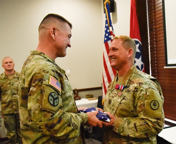Brig. Gen. Jimmie Cole, Tennessee’s Land Component Commander, presents Command Sgt. Maj. Michael Gentry with an American flag at Gentry’s retirement ceremony, July 8, at Smyrna’s Event Center. Gentry served for more than 36 years and was the State Command Sergeant Major from October 2015 until he retired this year. Brig. Gen. Jimmie Cole, Tennessee’s Land Component Commander, presents Command Sgt. Maj. Michael Gentry with an American flag at Gentry’s retirement ceremony, July 8, at Smyrna’s Event Center. Gentry served for more than 36 years and was the State Command Sergeant Major from October 2015 until he retired this year.