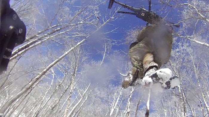 Sgt. 1st Class Tracy Banta, a Critical Care Flight Paramedic, is hoisted to a UH-60 Blackhawk helicopter after rescuing a stranded hiker on the Appalachian Trail, Jan. 18. The Tennessee National Guard conducted the rescue mission after being notified of a stranded hiker in the Great Smoky Mountain National Park. (Courtesy photo from the Tennessee National Guard) Sgt. 1st Class Tracy Banta, a Critical Care Flight Paramedic, is hoisted to a UH-60 Blackhawk helicopter after rescuing a stranded hiker on the Appalachian Trail, Jan. 18. The Tennessee National Guard conducted the rescue mission after being notified of a stranded hiker in the Great Smoky Mountain National Park. (Courtesy photo from the Tennessee National Guard)