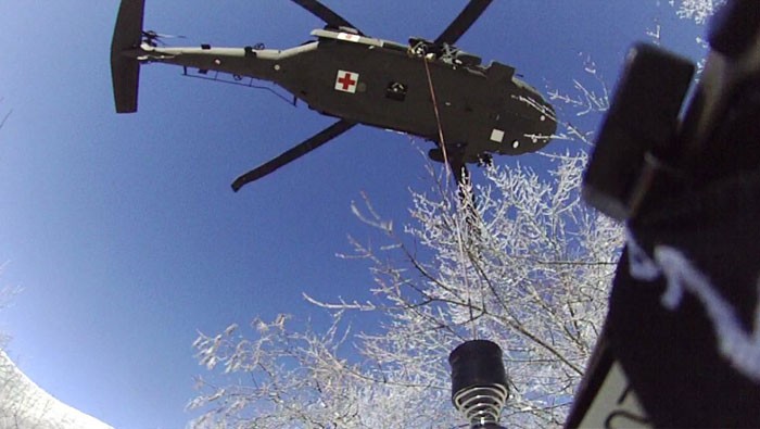 Sgt. Chris Farrar lowers Sgt. 1st Class Tracy Banta, a Critical Care Flight Paramedic, to a stranded hiker on the Appalachian Trail, Jan. 18. The Tennessee National Guard conducted the rescue mission after being notified of a stranded hiker in the Great Smoky Mountain National Park. (Courtesy photo from the Tennessee National Guard) Sgt. Chris Farrar lowers Sgt. 1st Class Tracy Banta, a Critical Care Flight Paramedic, to a stranded hiker on the Appalachian Trail, Jan. 18. The Tennessee National Guard conducted the rescue mission after being notified of a stranded hiker in the Great Smoky Mountain National Park. (Courtesy photo from the Tennessee National Guard)