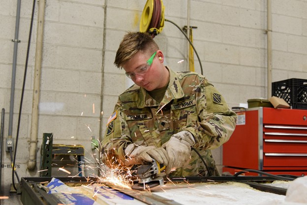 Spc. Dustin Padilla prepares a replacement part for a field kitchen. He has worked for Allied Trades for six months at the Volunteer Training Site in Smyrna, Tenn. (Photo by retired Sgt 1st Class Edgar Castro) Spc. Dustin Padilla prepares a replacement part for a field kitchen. He has worked for Allied Trades for six months at the Volunteer Training Site in Smyrna, Tenn. (Photo by retired Sgt 1st Class Edgar Castro)