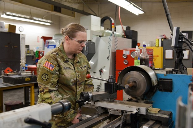Staff Sgt. Stephanie Licerio uses a grinder to make a new part for a Humvee. She works at the Volunteer Training Site in Smyrna, Tenn. (Photo by retired Sgt 1st Class Edgar Castro) Staff Sgt. Stephanie Licerio uses a grinder to make a new part for a Humvee. She works at the Volunteer Training Site in Smyrna, Tenn. (Photo by retired Sgt 1st Class Edgar Castro)