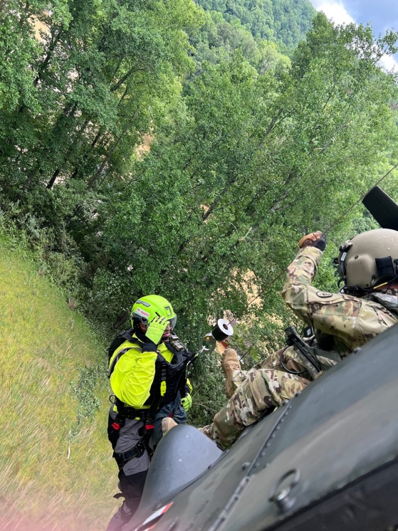 A crewmember is lowered from a Blackhawk helicopter to rescue a flood victim in Eastern Kentucky. (Submitted photo)