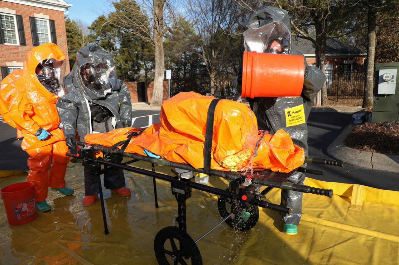 Members of the Tennessee National Guard’s 45th Civil Support Team conduct decontamination procedures on a “man-down” exercise during their Training Proficiency Evaluation, Jan. 10, in Murfreesboro. The evaluation is administered by U.S. Army North and is a congressionally mandated examination to validate the readiness of civil support teams every 18 months. (Photo by Sgt. 1st Class Timothy Cordeiro) Members of the Tennessee National Guard’s 45th Civil Support Team conduct decontamination procedures on a “man-down” exercise during their Training Proficiency Evaluation, Jan. 10, in Murfreesboro. The evaluation is administered by U.S. Army North and is a congressionally mandated examination to validate the readiness of civil support teams every 18 months. (Photo by Sgt. 1st Class Timothy Cordeiro)