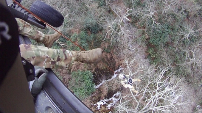 Staff Sgt. Ryan McKnight lowers Staff Sgt. John Sharbel during a recovery mission on the Appalachian Trail, Dec. 31, 2022. Local authorities requested help from the Tennessee Emergency Management Agency and the Tennessee National Guard to rescue two stranded hikers the morning of New Year’s Eve. The two hikers were airlifted to Johnson City Medical Center where they recovered from minor injuries before being released. (Submitted photo) Staff Sgt. Ryan McKnight lowers Staff Sgt. John Sharbel during a recovery mission on the Appalachian Trail, Dec. 31, 2022. Local authorities requested help from the Tennessee Emergency Management Agency and the Tennessee National Guard to rescue two stranded hikers the morning of New Year’s Eve. The two hikers were airlifted to Johnson City Medical Center where they recovered from minor injuries before being released. (Submitted photo)