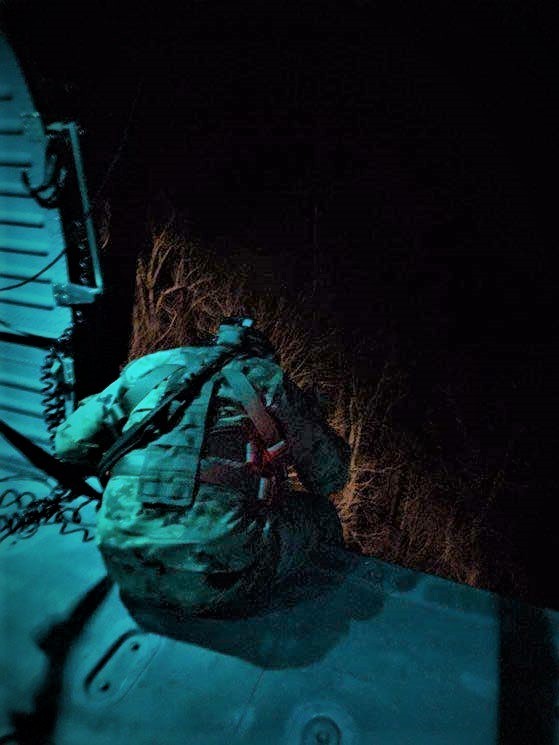 Tennessee Army National Guard Blackhawk helicopter crew chief, Sgt. Gabriel Weston, locates a hiker in distress and prepares the aircraft hoist to begin rescuing the hiker in the Great Smoky Mountain National Park, near the Silers Bald Shelter, along the Appalachian Trail, in the early morning of April 5. (Submitted photo) Tennessee Army National Guard Blackhawk helicopter crew chief, Sgt. Gabriel Weston, locates a hiker in distress and prepares the aircraft hoist to begin rescuing the hiker in the Great Smoky Mountain National Park, near the Silers Bald Shelter, along the Appalachian Trail, in the early morning of April 5. (Submitted photo)