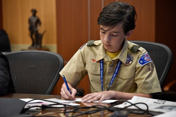 A scout writes a letter to an elected official while earning the citizenship in the nation merit badge at the 2nd Annual Merit Badge University hosted by the Tennessee Military Department at the Joint Force Headquarters in Nashville, April 29. (photo by retired Sgt. 1st Class William Jones) A scout writes a letter to an elected official while earning the citizenship in the nation merit badge at the 2nd Annual Merit Badge University hosted by the Tennessee Military Department at the Joint Force Headquarters in Nashville, April 29. (photo by retired Sgt. 1st Class William Jones)