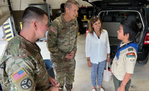 Maj. Gen. Jimmie Cole, Tennessee’s Deputy Adjutant General, Gen. Daniel Hokanson, Chief of the National Guard Bureau, and his wife, Kelly, talk with a scout participating in the automotive maintenance merit badge at the 2nd Annual Merit Badge University hosted by the Tennessee Military Department at the Joint Force Headquarters in Nashville, April 29. (official National Guard photo) Maj. Gen. Jimmie Cole, Tennessee’s Deputy Adjutant General, Gen. Daniel Hokanson, Chief of the National Guard Bureau, and his wife, Kelly, talk with a scout participating in the automotive maintenance merit badge at the 2nd Annual Merit Badge University hosted by the Tennessee Military Department at the Joint Force Headquarters in Nashville, April 29. (official National Guard photo)