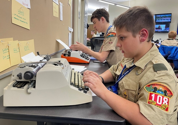 Scouts learn how to write using a manual typewriter while attending journalism merit badge at the 2nd Annual Merit Badge University hosted by the Tennessee Military Department at the Joint Force Headquarters in Nashville, April 29. (photo by Lt. Col. Darrin Haas) Scouts learn how to write using a manual typewriter while attending journalism merit badge at the 2nd Annual Merit Badge University hosted by the Tennessee Military Department at the Joint Force Headquarters in Nashville, April 29. (photo by Lt. Col. Darrin Haas)