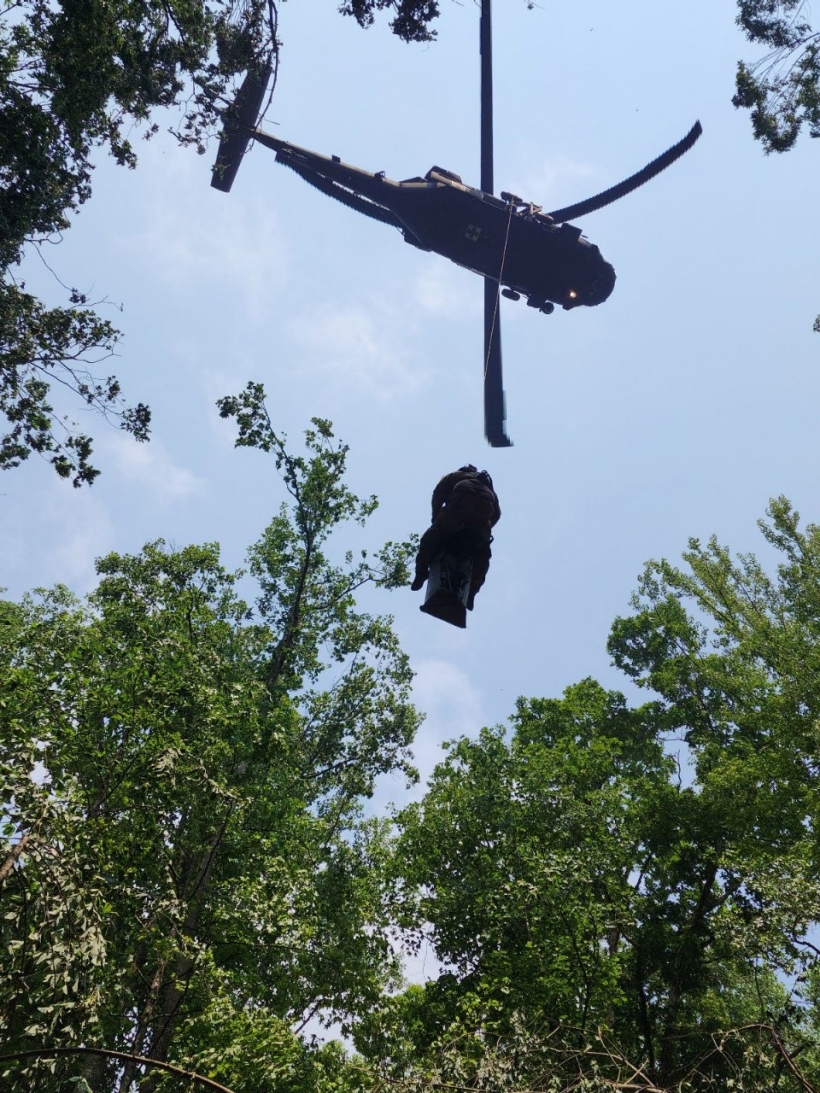 An injured hiker and a Tennessee Army National Guard flight paramedic are hoisted into a Blackhawk helicopter during a rescue at the Cumberland Gap National Historic Park, June 28. (Submitted photo) An injured hiker and a Tennessee Army National Guard flight paramedic are hoisted into a Blackhawk helicopter during a rescue at the Cumberland Gap National Historic Park, June 28. (Submitted photo)