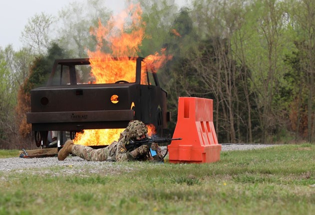 Spc. Noah Green, a member of the Tennessee National Guard’s 890th Sapper Company, conducts the ‘military operations in urban terrain’ event, April 18, during the Region III Best Warrior Competition at Wendell H. Ford Regional Training Center in Greenville, Kentucky. Green took first place in the competition which was held from April 14–19, beating out competitors from nine other states and territories in the southeast, earning him the opportunity to compete at the National Best Warrior Competition, in August. (photo by Sgt. 1st Class Timothy Cordeiro) Spc. Noah Green, a member of the Tennessee National Guard’s 890th Sapper Company, conducts the ‘military operations in urban terrain’ event, April 18, during the Region III Best Warrior Competition at Wendell H. Ford Regional Training Center in Greenville, Kentucky. Green took first place in the competition which was held from April 14–19, beating out competitors from nine other states and territories in the southeast, earning him the opportunity to compete at the National Best Warrior Competition, in August. (photo by Sgt. 1st Class Timothy Cordeiro)