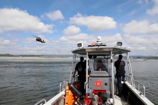 Members of the Chattanooga Fire Department keep watch over volunteers that agreed to act as flooding victims swept into the Chickamauga Dam during a simulated flooding event requiring the efforts of the Helicopter Aquatic Rescue Team Thursday, May 16. The exercise, which simulated a real-life scenario, tested the team’s response time and ability to extract victims quickly and safely from the water, as well as their coordination with local emergency responders. (U.S. Army National Guard photo by Sgt. First Class Mathieu Perry) Members of the Chattanooga Fire Department keep watch over volunteers that agreed to act as flooding victims swept into the Chickamauga Dam during a simulated flooding event requiring the efforts of the Helicopter Aquatic Rescue Team Thursday, May 16. The exercise, which simulated a real-life scenario, tested the team’s response time and ability to extract victims quickly and safely from the water, as well as their coordination with local emergency responders. (U.S. Army National Guard photo by Sgt. First Class Mathieu Perry)