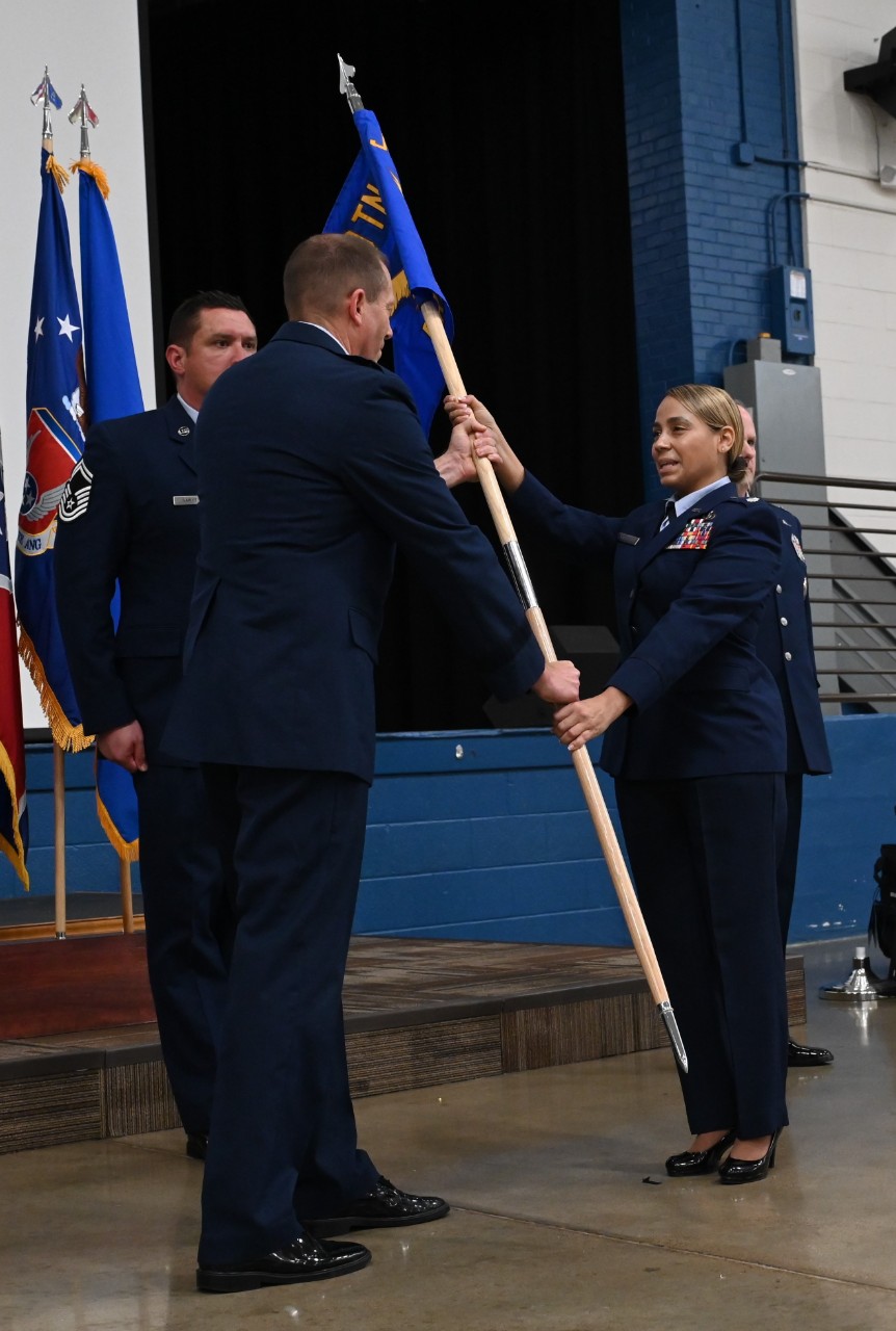 Lt. Col. Naudia Cartmell receives the unit guidon and assumes command of the Tennessee Air National Guard’s newest unit, Tennessee’s Recruiting and Retention Squadron, during a special ceremony at Nashville’s Joint Force Headquarters on August 2. (photo courtesy of the 118th Wing) Lt. Col. Naudia Cartmell receives the unit guidon and assumes command of the Tennessee Air National Guard’s newest unit, Tennessee’s Recruiting and Retention Squadron, during a special ceremony at Nashville’s Joint Force Headquarters on August 2. (photo courtesy of the 118th Wing)