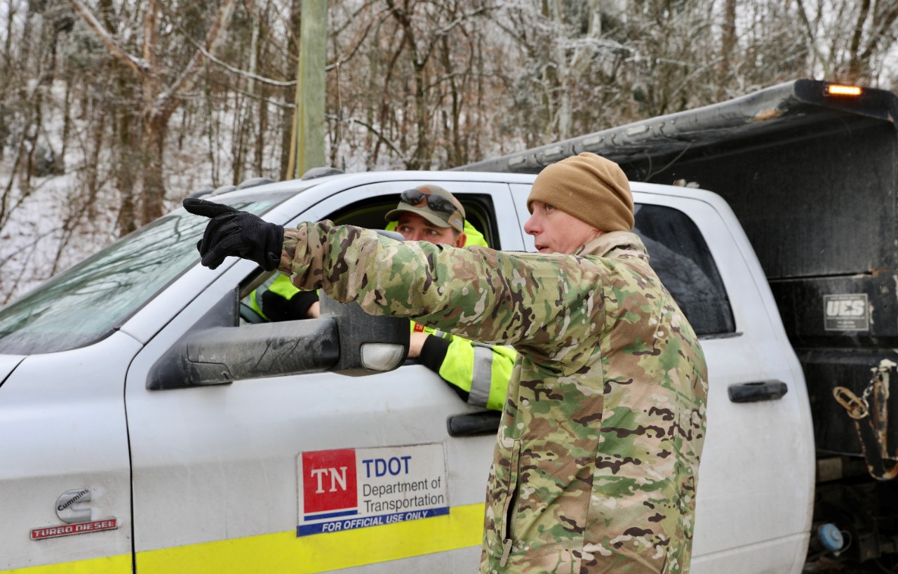 A Soldier with the Tennessee Army National Guard’s 212th Engineer Company works with the Tennessee Department of Transportation during clearing debris in Davidson County on January 31. Guardsmen are supporting state, county, and local emergency responders as they assist Tennesseans affected by Winter Storm Fern. (photo by Capt. Kealy Moriarty) A Soldier with the Tennessee Army National Guard’s 212th Engineer Company works with the Tennessee Department of Transportation during clearing debris in Davidson County on January 31. Guardsmen are supporting state, county, and local emergency responders as they assist Tennesseans affected by Winter Storm Fern. (photo by Capt. Kealy Moriarty)