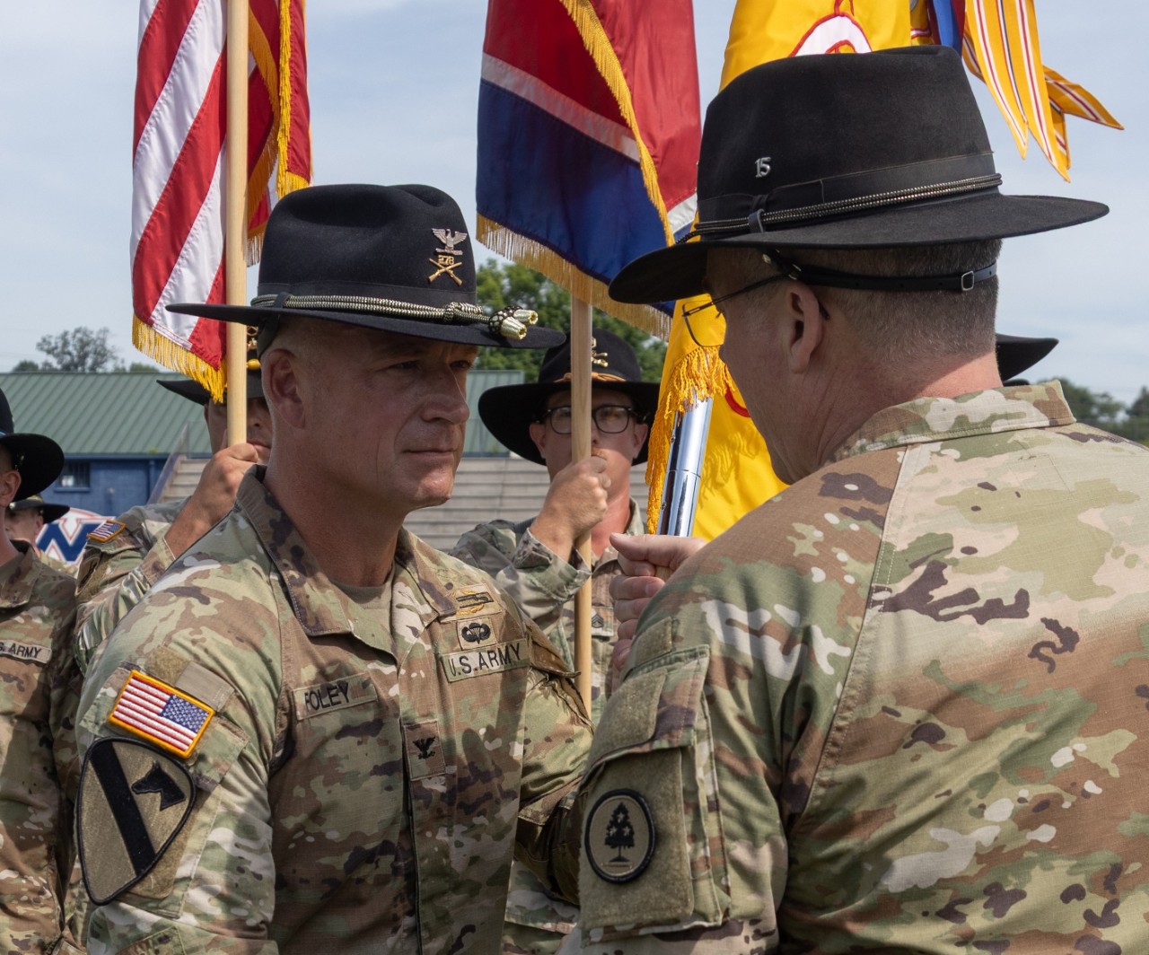 Col. Thomas “TJ” Foley accepts the 278th Cavalry Regiment’s unit colors from Brig. Gen. Steven Turner, Tennessee’s Assistant Adjutant General–Army, during the Tennessee Army National Guard’s 278th Cavalry Regiment (MBCT) change of command ceremony at West High School’s football field, in Knoxville, on Sunday, June 7. Foley, who has 28 years of military service, was recently the Deputy Chief of Staff–Operations at the Tennessee National Guard’s Joint Force Headquarters in Nashville before taking command of the 278th. (photo by: Sgt. Casandra Marrero) Col. Thomas “TJ” Foley accepts the 278th Cavalry Regiment’s unit colors from Brig. Gen. Steven Turner, Tennessee’s Assistant Adjutant General–Army, during the Tennessee Army National Guard’s 278th Cavalry Regiment (MBCT) change of command ceremony at West High School’s football field, in Knoxville, on Sunday, June 7. Foley, who has 28 years of military service, was recently the Deputy Chief of Staff–Operations at the Tennessee National Guard’s Joint Force Headquarters in Nashville before taking command of the 278th. (photo by: Sgt. Casandra Marrero)