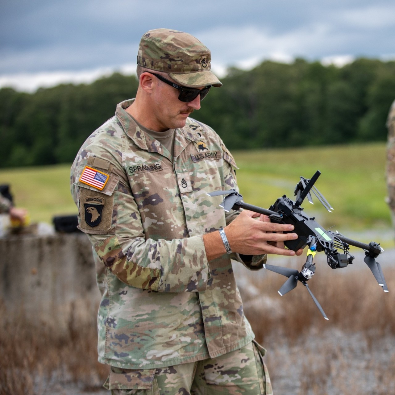Staff Sgt. Alexander Spradling, an instructor with the 1-117th Military Police Battalion’s Multifunction Company prepares to launch an RQ-28A, a small, unmanned aircraft during the Small Unmanned Aircraft System Master Trainer pilot course at Tullahoma’s Volunteer Training Site, June 23. Unlike the Army’s basic operator course, the Master Trainer Course prepares experienced operators to certify future SUAS pilots, manage unit training programs, and advise commanders on unmanned aircraft system employment. Facilitated by Tennessee’s 117th Regional Training Institute, this is the first course of its kind in the Army National Guard. (photo by 1st Lt. Bailey Breving)
