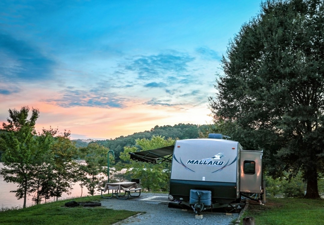 Conserving Tennessee Trails, an RV parked by the lake. Find out more about how we are conserving tennessee trails.