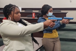 Picture showing students using a firearms simulator 