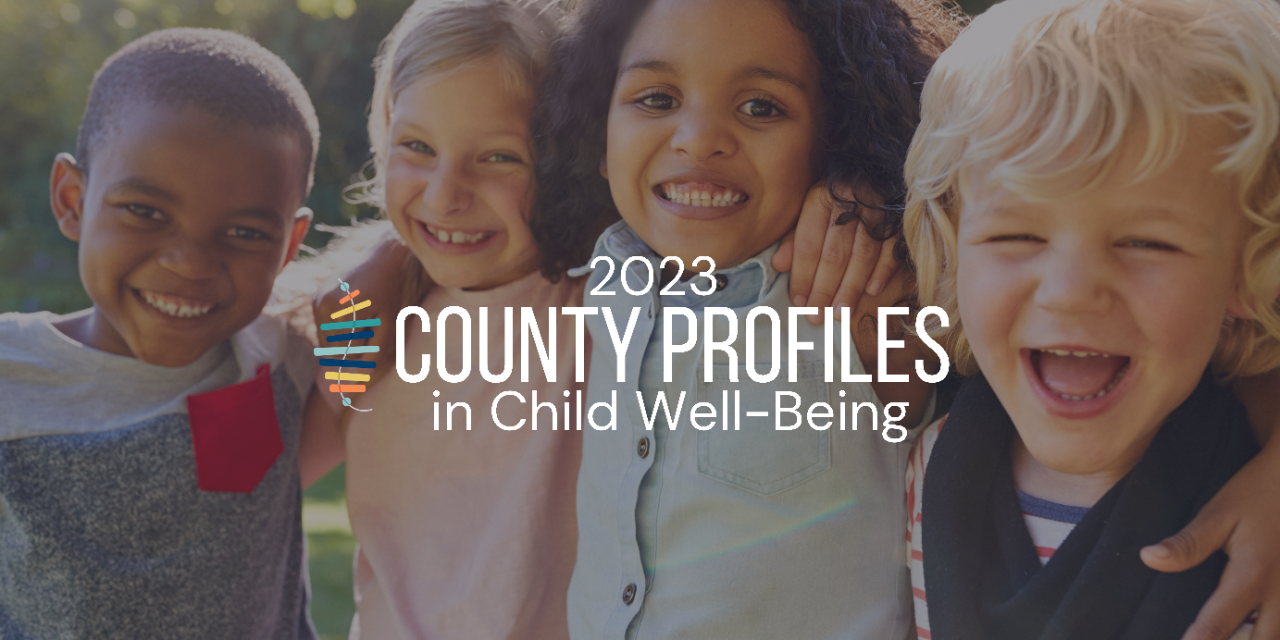 Copy of 2023 County Profiles (Banner (Landscape)) Four young, diverse children with arms around each other, smiling happily at camera
