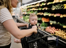SNAP A mother and small child look at produce in the grocery store