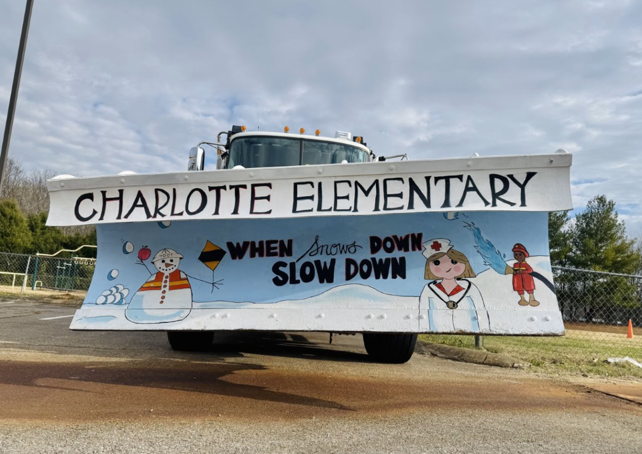 Image shows snowplow with mural painted on plow blade Image shows snowplow with mural painted on plow blade