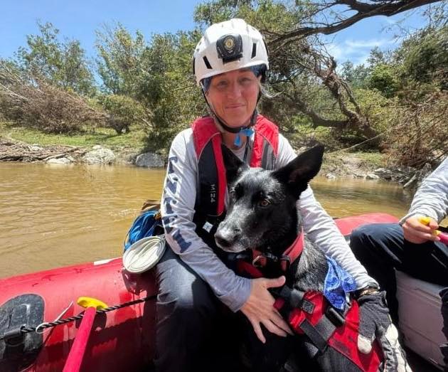 Tennessee Task Force 1 embedded with Texas Task Force 1 in Kerr County, Texas. Search team member with search dog in boat.