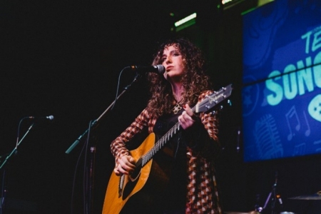 singer playing guitar