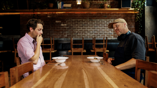 Chefs and Artists Collaborate to Explore How Music Can Influence Flavor Two men sitting at a table across from each other