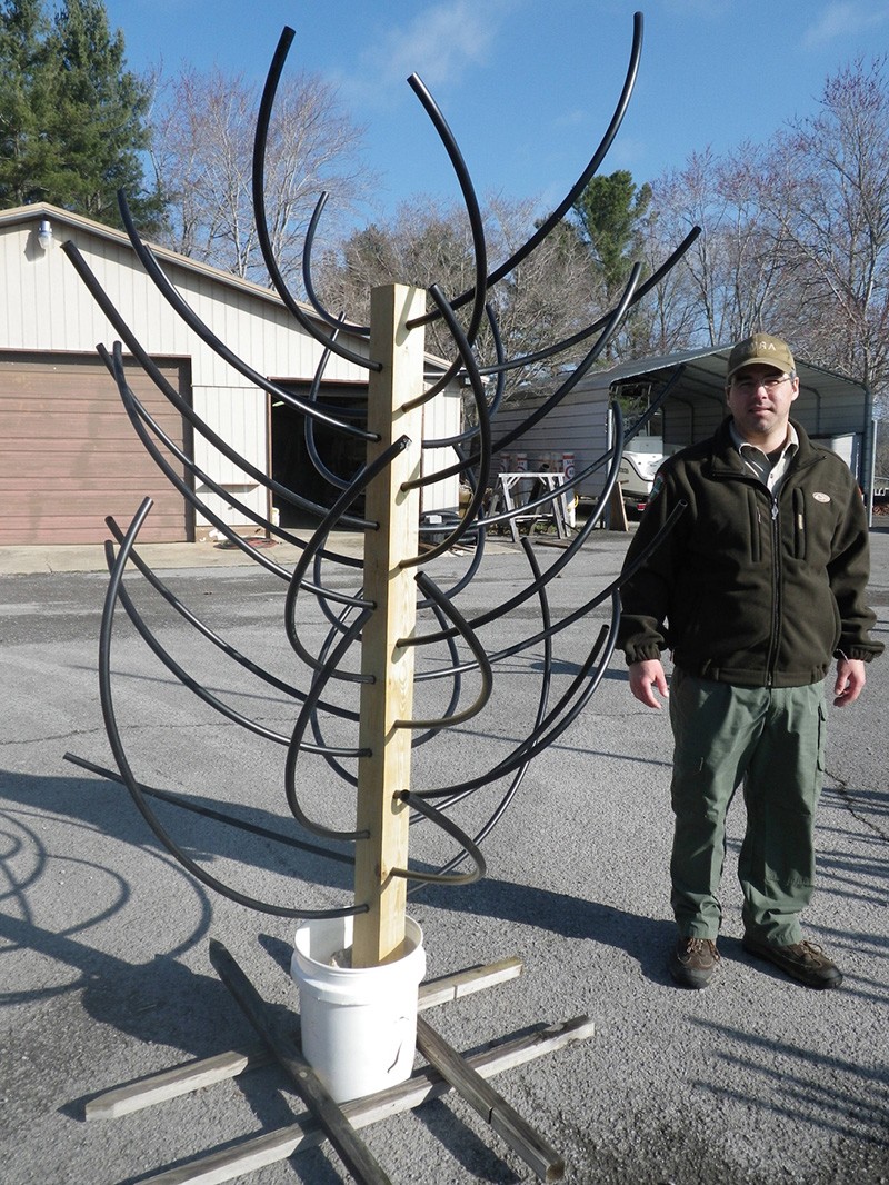 Fish tree made from wooden post and surplus plastic gas pipe