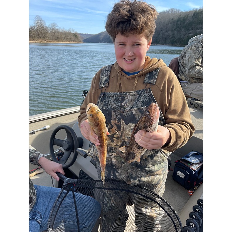 Maddox Donovan showing some sauger he caught on Cordell Hull in Tennesssee.
