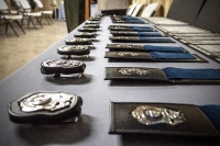 Table with badges for new officers