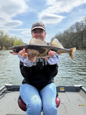 Beverly Miller shows a new catch.