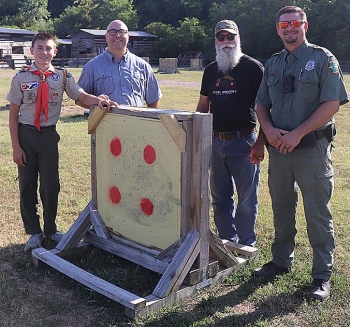 Eagle Scout Jacob Harris, TWRA officer Hayden Cook in front of a new archery target