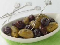 a small dish of green and black olives