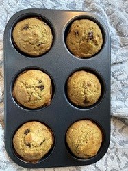Gluten-Free Banana Quinoa Muffins with Chocolate Chips six muffins in a tin muffin pan