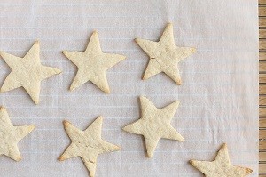 Star-shaped sugar cookies on a baking sheet