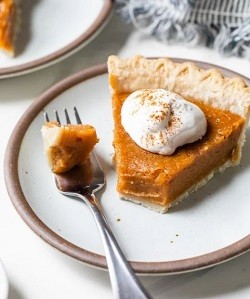 Sweet Potato Pie a slice of sweet potato pie on a plate