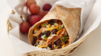 Black Bean and Chicken Burrito a burrito with a side of grapes
