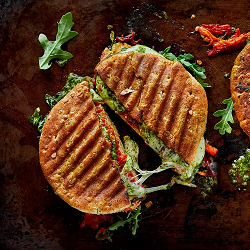 Chicken Pesto Panini a chicken pesto panini cut in half