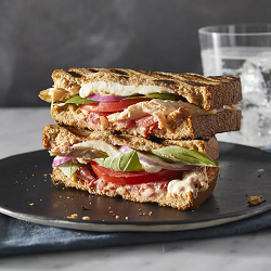 Copycat Frontega Chicken Sandwich cut in two and stacked on top of each other