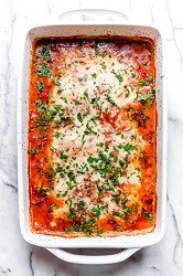 Lighter Eggplant Parmesan eggplant parmesan in a casserole dish