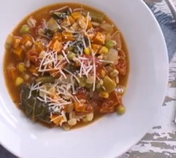 bowl of vegetable barley soup with grated cheese