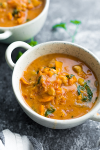 Vegan Slow Cooker Peanut Stew two bowls of Vegan Slow Cooker Peanut Stew