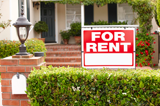 Renter/Landlord For Rent sign in front of house