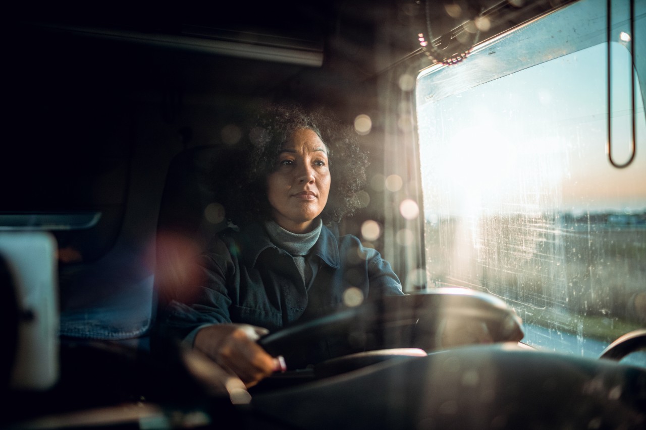 OTR Vehicle Safety Woman sits at steering wheel of truck