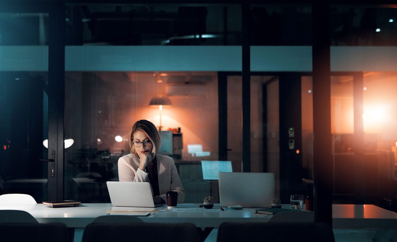 Working Alone Woman alone at computer in office
